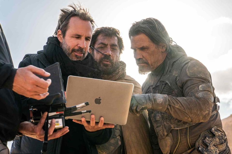 <p>Niko Tavernise/Warner Bros. Pictures</p> (Left-right:)  Denis Villeneuve, Javier Bardem and Josh Brolin on the set of "Dune: Part Two"