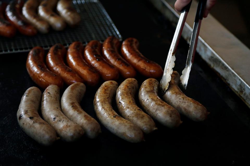 Matt Schmidt of Schmidt's Sausage Haus cooks up Bahama Mamas during the opening day of the Ohio State Fair on July 26, 2017.  Schmidt's Sausage Haus has been a vendor at the Ohio State Fair for more than a century.