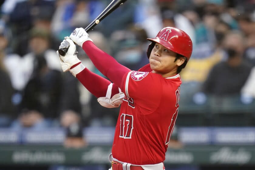 Los Angeles Angels' Shohei Ohtani watches the path of his fly ball that was caught for an out.