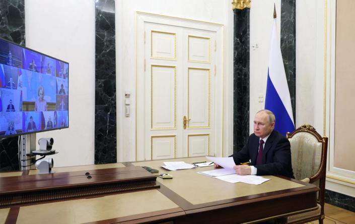 Russian president Vladimir Putin chairs a meeting with members of the government, via a video conference in Moscow, Russia (EPA)