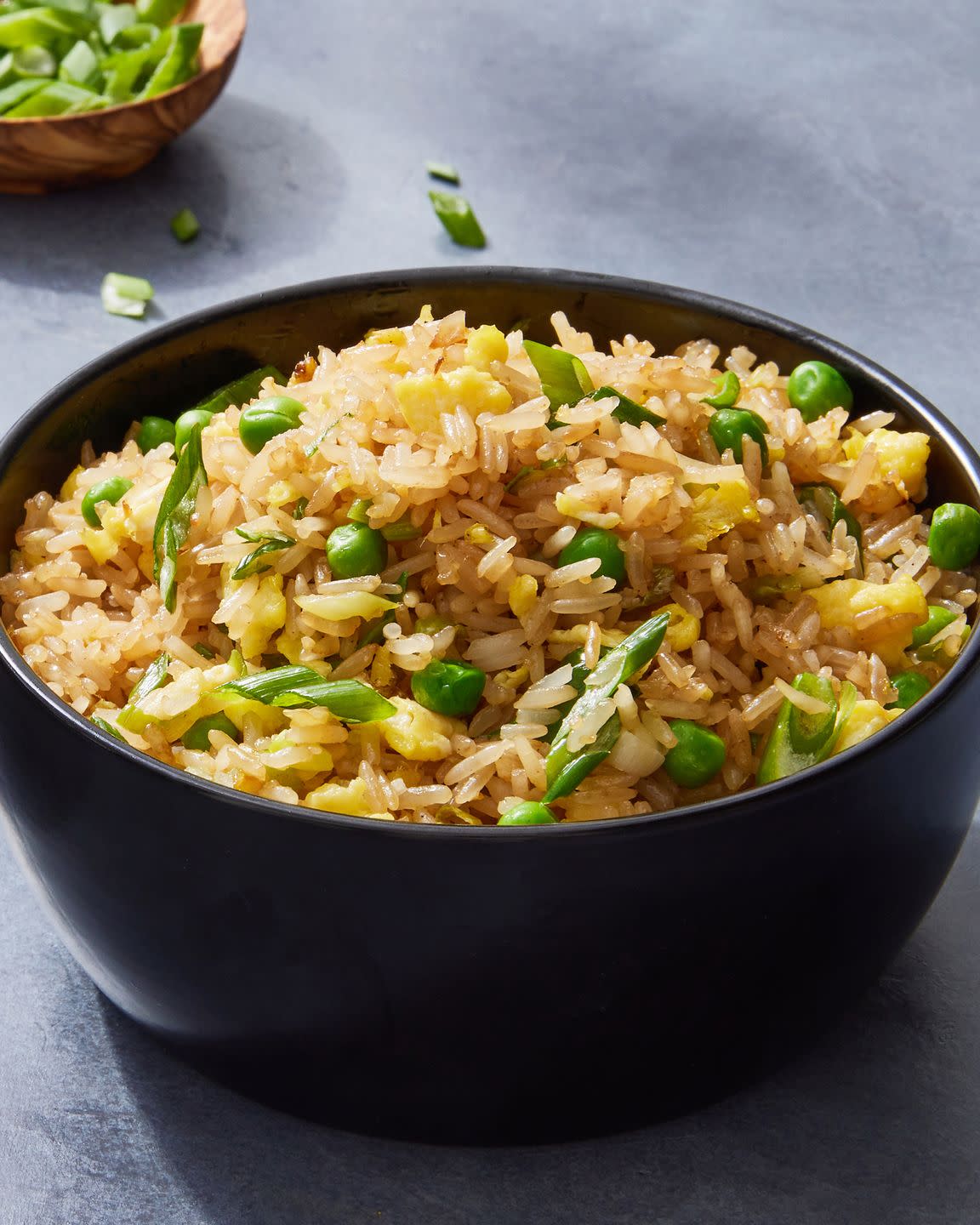 fried rice with peas, eggs, and green onions