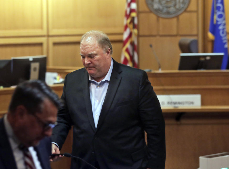 Former Wisconsin Supreme Court Justice Michael Gableman, an investigator hired by Republicans to look into former President Donald Trump's 2020 loss in the battleground state, who refused to answer questions from Circuit Court Judge Frank Remington, leaves the stand, Friday, June 10, 2022, at the Dane County Courthouse in Madison, Wis. Gableman was found in contempt after he berated the judge and refused to answer any questions on the witness stand. (Amber Arnold/Wisconsin State Journal via AP)