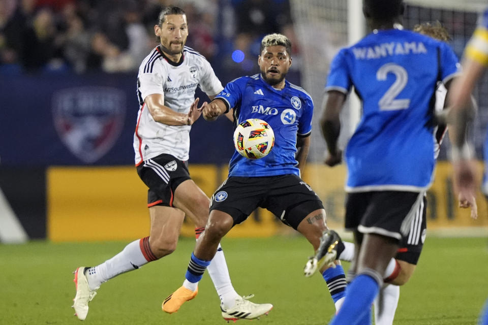 CF Montreal midfielder Josef Martinez, center, and FC Dallas defender Omar Gonzalez, left, chase the ball during the second half of an MLS soccer match Saturday, March 2, 2024, in Frisco, Texas. (AP Photo/LM Otero)