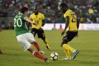 Jul 23, 2017; Pasadena, CA, USA; Jamaica defender Kemar Lawrence (20) moves the ball defended by Mexico midfielder Jesus Duenas (20) during the second half at Rose Bowl. Kelvin Kuo-USA TODAY Sports