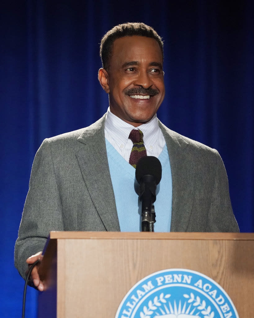 tim smiling at a podium