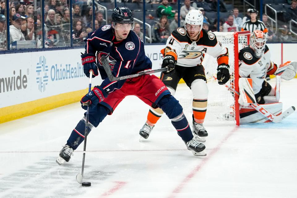 Oct 24, 2023; Columbus, Ohio, USA; Columbus Blue Jackets center Adam Fantilli (11) controls the puck in front of Anaheim Ducks defenseman Cam Fowler (4) during the third period of the NHL game at Nationwide Arena. The Blue Jackets lost 3-2 (OT).