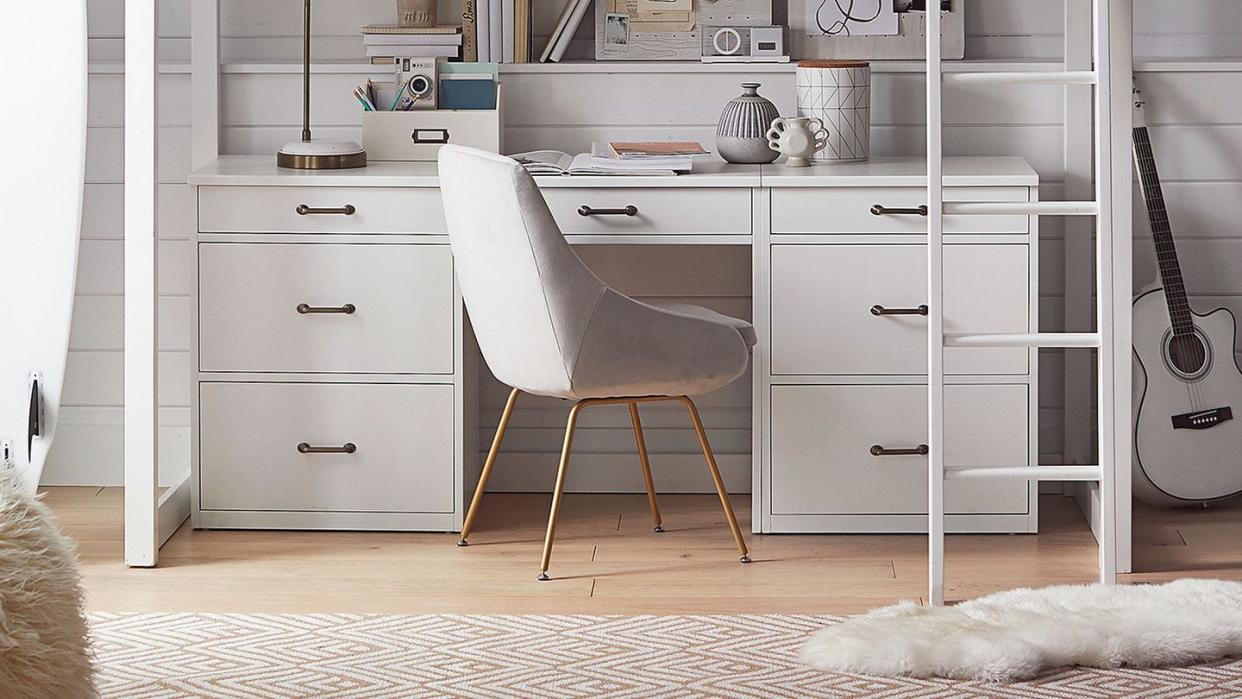 a white kitchen with a white cabinet