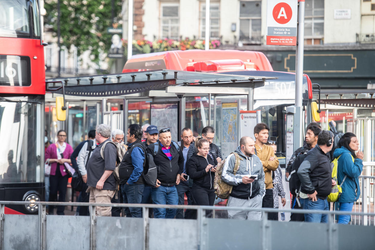 Commuters on busses outside of Victoria Station. (SWNS)