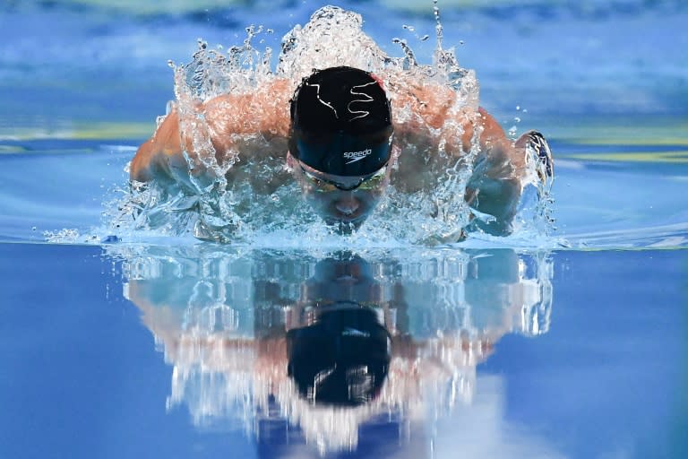 Singapore's Joseph Schooling successfully defended his 100m butterfly title