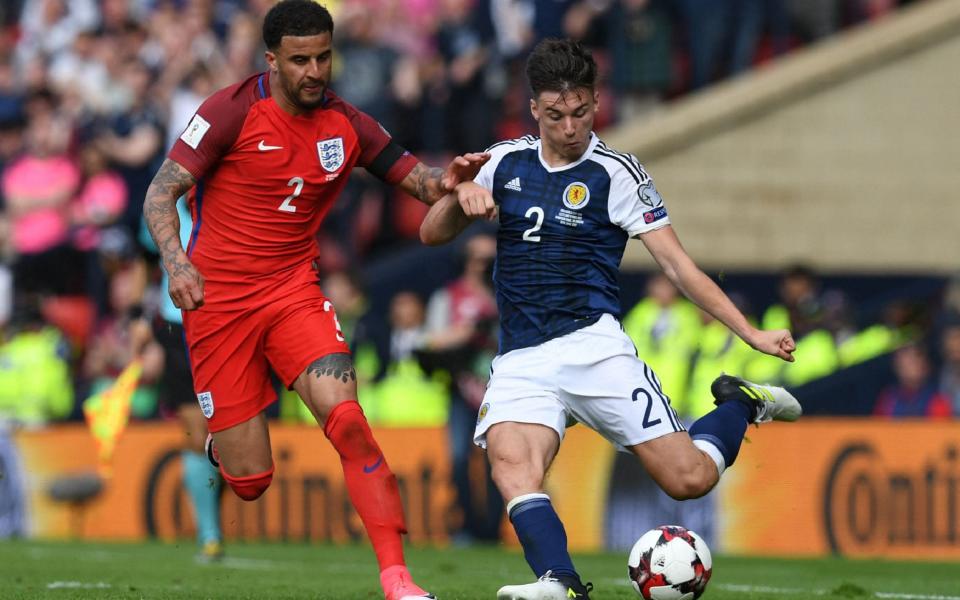 Kieran Tierney (right) in action against England back in 2017 - AFP