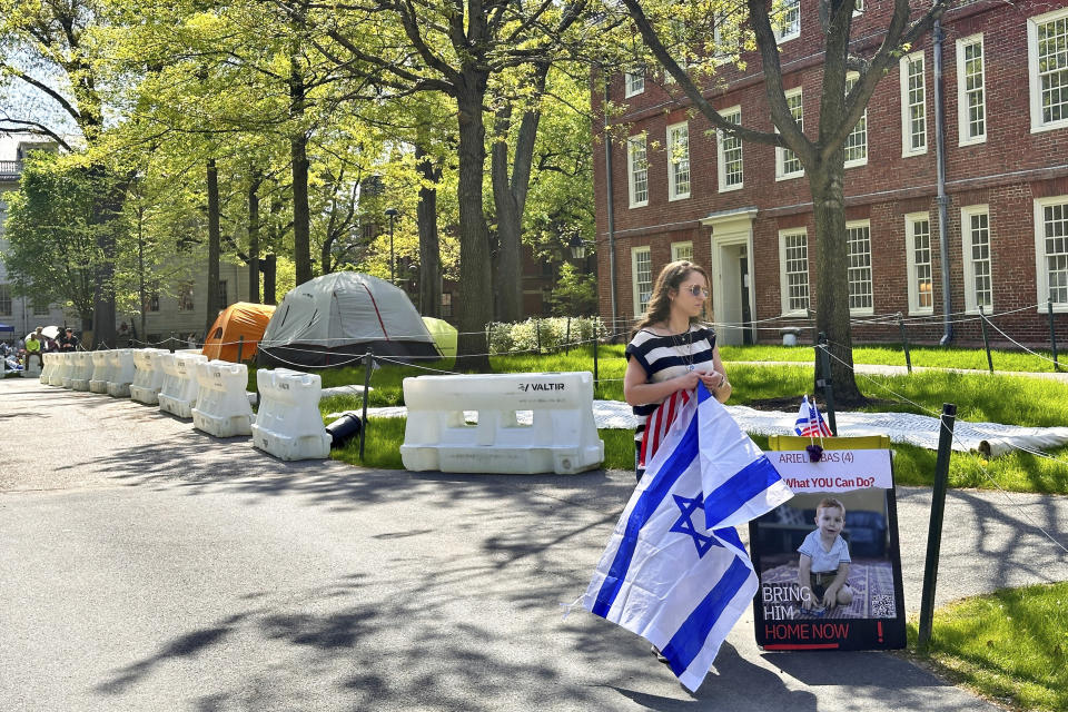 Rotem Spiegler, an alumni of Harvard University, stands near an encampment set up at the university to protest the war in Gaza, Tuesday, May 14, 2024, in Cambridge, Mass. The encampment was being voluntarily removed early Tuesday. (AP Photo/Michael Casey)