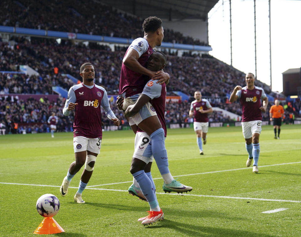 Aston Villa's Moussa Diaby, right, celebrates with Ollie Watkins after scoring their second goal of the game during the English Premier League soccer match between Bournemouth and Aston Villa at Villa Park stadium in Birmingham, England, Sunday April 21, 2024. (David Davies/PA via AP)