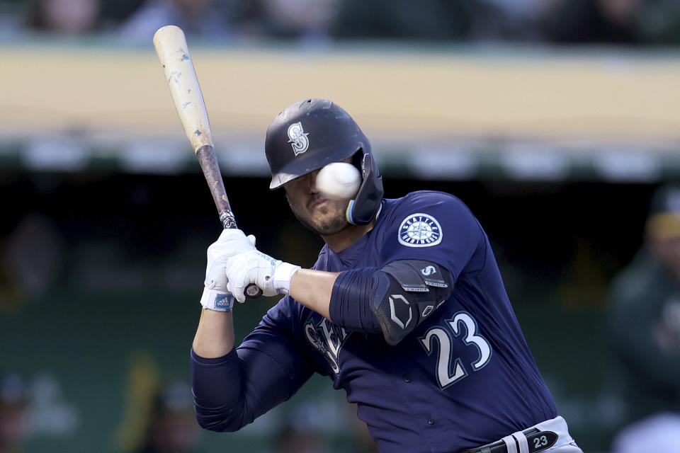 Seattle Mariners' Ty France avoids an inside pitch from the Oakland Athletics during the first inning of a baseball game in Oakland, Calif., Tuesday, Sept. 20, 2022. (AP Photo/Jed Jacobsohn)