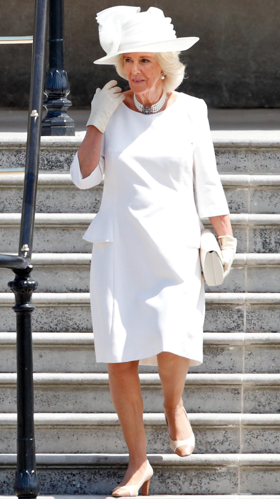 Queen Camilla in an all-white ensemble