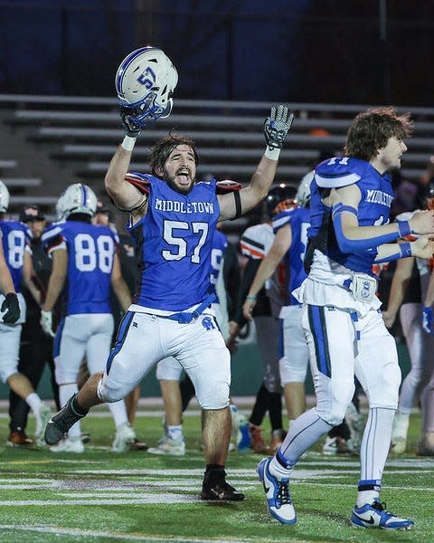 Middletown's TJ Buzard celebrates the Islanders victory over West Warwick in the Division III Super Bowl on Saturday night at Cranston Stadium.
