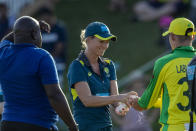 Australia's Marnus Labuschagne, right uses hand sanitizer, at the end of the 3rd and final One Day International cricket match between South Africa and Australia at Senwes Park, Potchefstroom, South Africa, Saturday, March 7, 2020. South Africa beat Australia by 6 wickets with 27 balls remaining. (AP Photo/Themba Hadebe)