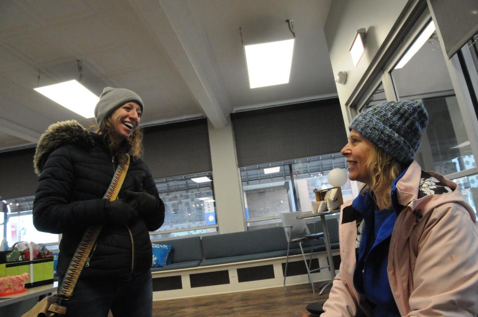 Regina Coughenour, executive director, and Kelley  Duppstadt, both of Somerset Inc. discuss their next step while in the Fire and Ice Festival's headquarters on Friday.