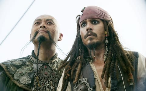 Chow Yun-fat (left) and Johnny Depp (right) in a scene from Pirates of the Caribbean: At World's End - Credit: Peter Mountain