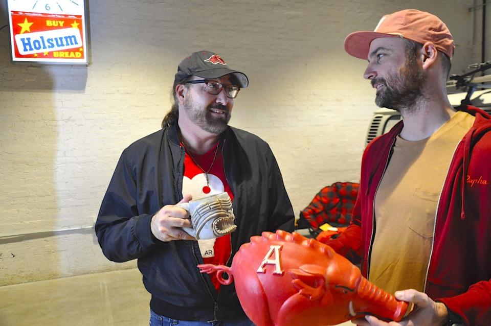 Ready for more March Madness and the Sweet Sixteen with the Hogs, filmmakers, Brandon Chase Goldsmith, left, of the Fort Smith International Film Festival, and Adam Harbottle, right, holding the Hog hat, are hosting a watch party for the game with Arkansas and Connecticut at 6:15 p.m. Thursday, March 23, 2023 at the Bakery District in Fort Smith, instead of the weekly film series, the screen will show basketball.