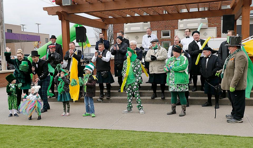 Mayor Matt Miller and his wife Melanie introduce the contestants for the Shiniest Shamrock contest from left, Spencer Heimberger and Olivia Conley, Serenity and Grayson Warrick, Blake Swanson, Emily Pauley and Tom Oakley in Foundation Plaza after the St. Patrick's Day parade Friday, March 17, 2023. TOM E. PUSKAR/ASHLAND TIMES-GAZETTE