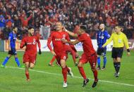 <p>Benoit Cheyrou #8 of Toronto FC celebrates a goal with Justin Morrow #2 during the second half of the MLS Eastern Conference Final, Leg 2 game against Montreal Impact at BMO Field on November 30, 2016 in Toronto, Ontario, Canada. (Photo by Vaughn Ridley/Getty Images) </p>