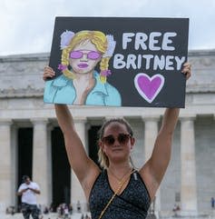 <span class="caption">A supporter of Britney Spears during a ‘Free Britney’ rally, July 14, 2021, in Washington. Some fans have held rallies since the pop star spoke out against her conservatorship in court.</span> <span class="attribution"><span class="source">(AP Photo/Jose Luis Magana)</span></span>