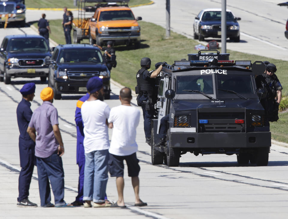 Police outside the Sikh temple in Oak Creek, Wis., after the shooting Aug 5, 2012.  (Jeffrey Phelps / AP)