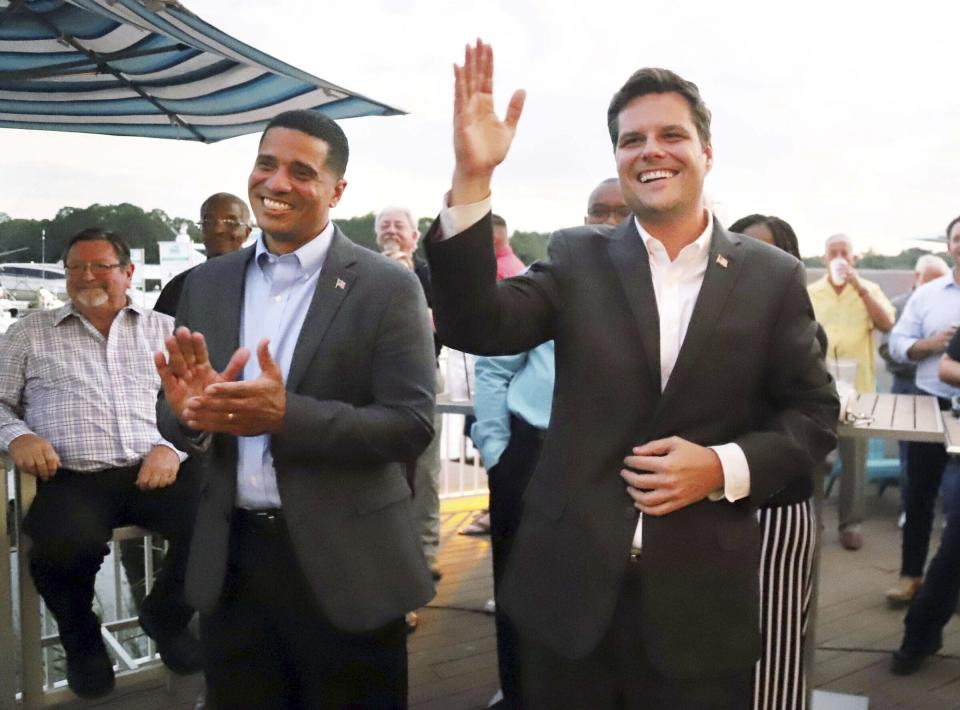 Flanked by U.S. Rep. Matt Gaetz at right, acting Superintendent of Okaloosa County Schools Marcus Chambers makes his announcement to officially run for the position in the 2020 election during an event in Niceville, Fla., on Tuesday, Oct. 8, 2019. Chambers was appointed to the position in January 2019 by Florida Gov. Ron DeSantis, who removed then-superintendent Mary Beth Jackson. (Michael Snyder/Northwest Florida Daily News via AP)