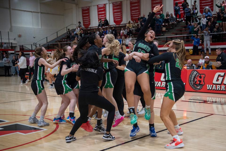 The North Lady Huskies celebrate their victory over the Central Lady Bears in the 2024 IHSAA Class 4A Girls Basketball Sectional 16 championship game at Harrison High School in Evansville, Ind., Saturday, Feb. 3, 2024.