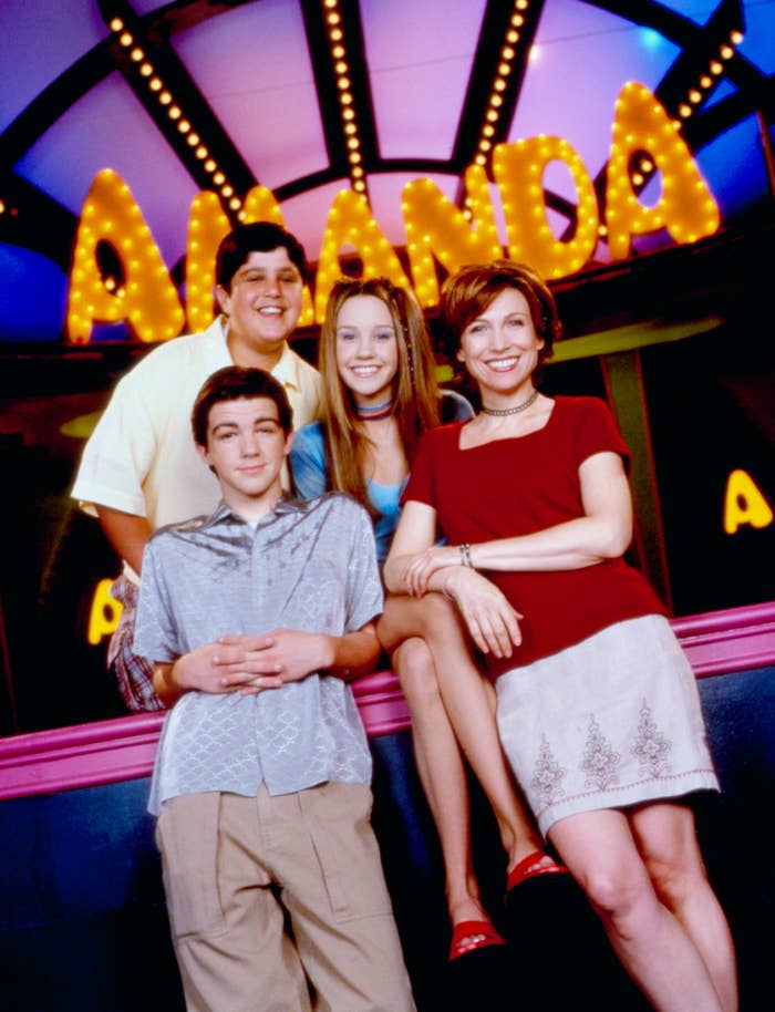 "The cast of 'The Amanda Show' poses together, featuring Amanda Bynes and co-stars in casual attire."