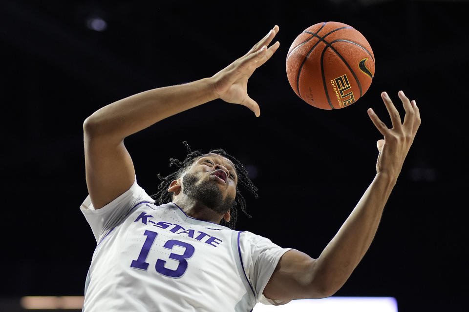 Kansas State forward Will McNair Jr. grabs a rebound during the second half of an NCAA college basketball game against West Virginia Monday, Feb. 26, 2024, in Manhattan, Kan. (AP Photo/Charlie Riedel)