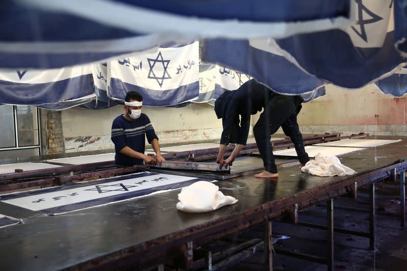 Large flag factory creates U.S. and Israeli flags for Iranian protesters to burn in Khomein City