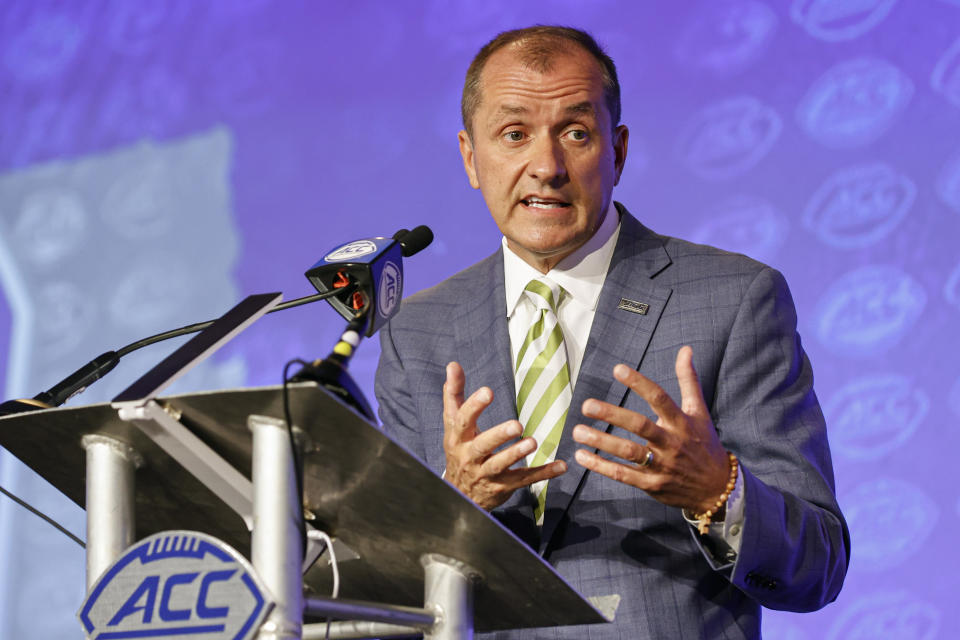 FILE - Atlantic Coast Conference Commissioner Jim Phillips answers a question during an NCAA college football news conference at the ACC media days in Charlotte, N.C., Wednesday, July 20, 2022. The Atlantic Coast Conference has cleared the way for Stanford, California and SMU to join the league, two people with direct knowledge of the decision told The Associated Press on Friday, Sept. 1, 2023, providing a landing spot for two more teams from the disintegrating Pac-12. (AP Photo/Nell Redmond, File)