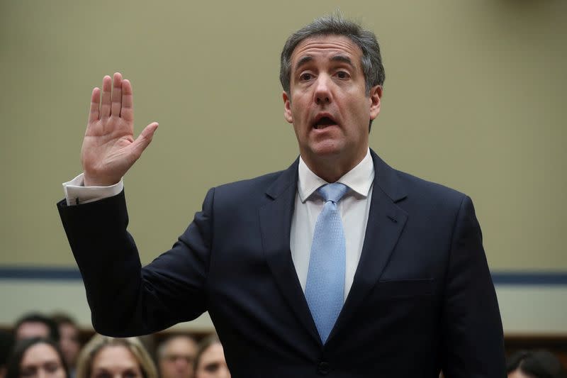 FILE PHOTO: Former Trump personal attorney Cohen is sworn in to testify before House Oversight hearing on Capitol Hill in Washington