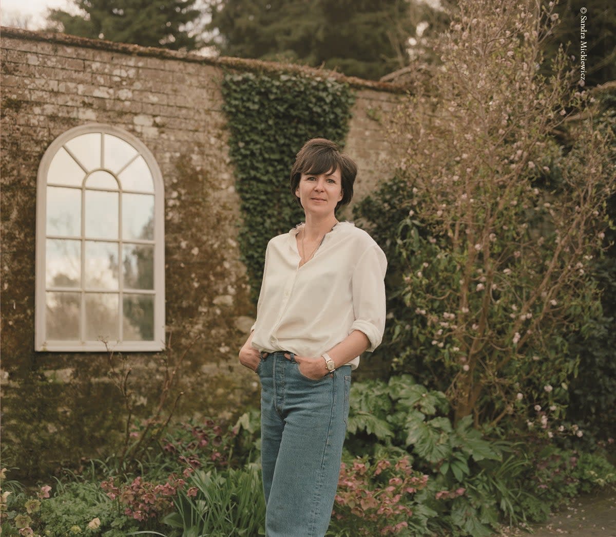 Olivia Laing in their Suffolk garden (Sandra Mickiewicz)