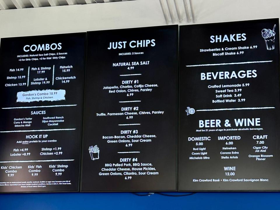 A black menu board with white text.