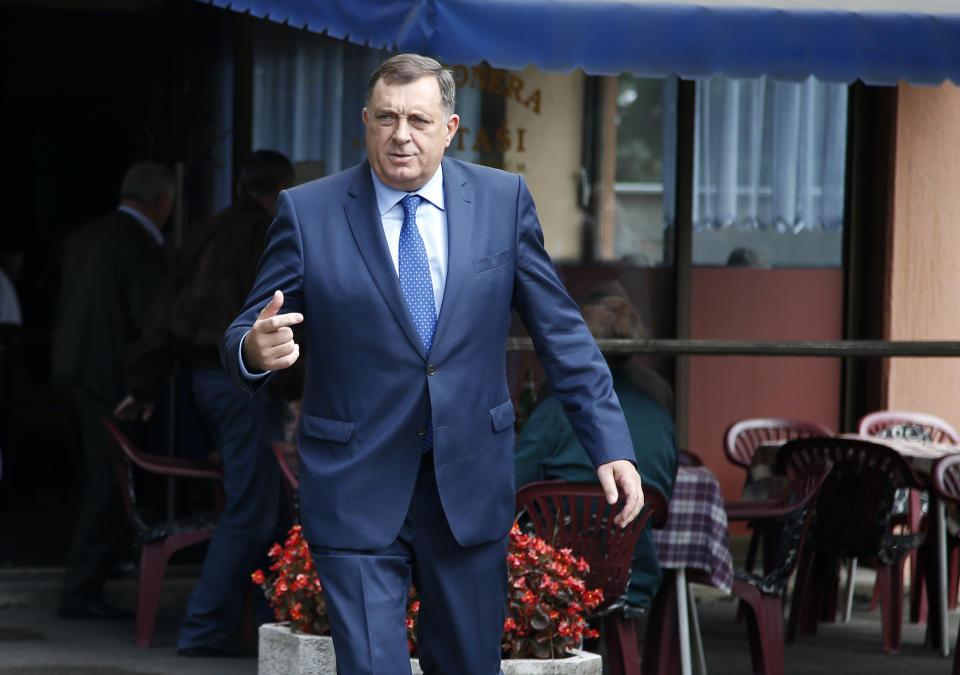 President of the Republic of Srpska Milorad Dodik leaves after voting in a general election in Laktasi, northwest of Sarajevo, Bosnia, Sunday, Oct. 7, 2018. Bosnians were voting Sunday in a general election that could install a pro-Russian nationalist to a top post and cement the ethnic divisions of a country that faced a brutal war 25 years ago. (AP Photo/Darko Vojinovic)