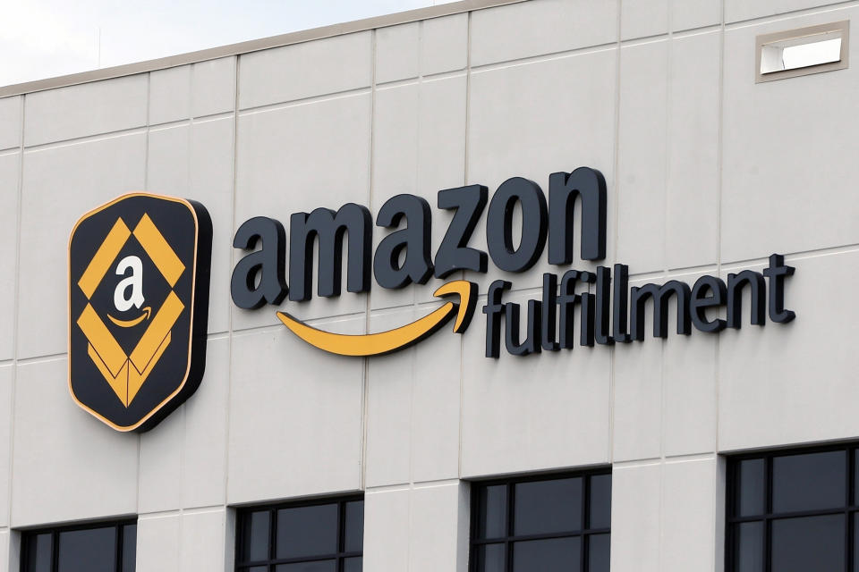 FILE - This July 8, 2019 file photo, shows the Amazon Fulfillment warehouse in Shakopee, Minn. Amazon will report quarterly earnings on Thursday, APril 30, 2020, providing a first glimpse into its financial performance during the pandemic. (AP Photo/Jim Mone, File)