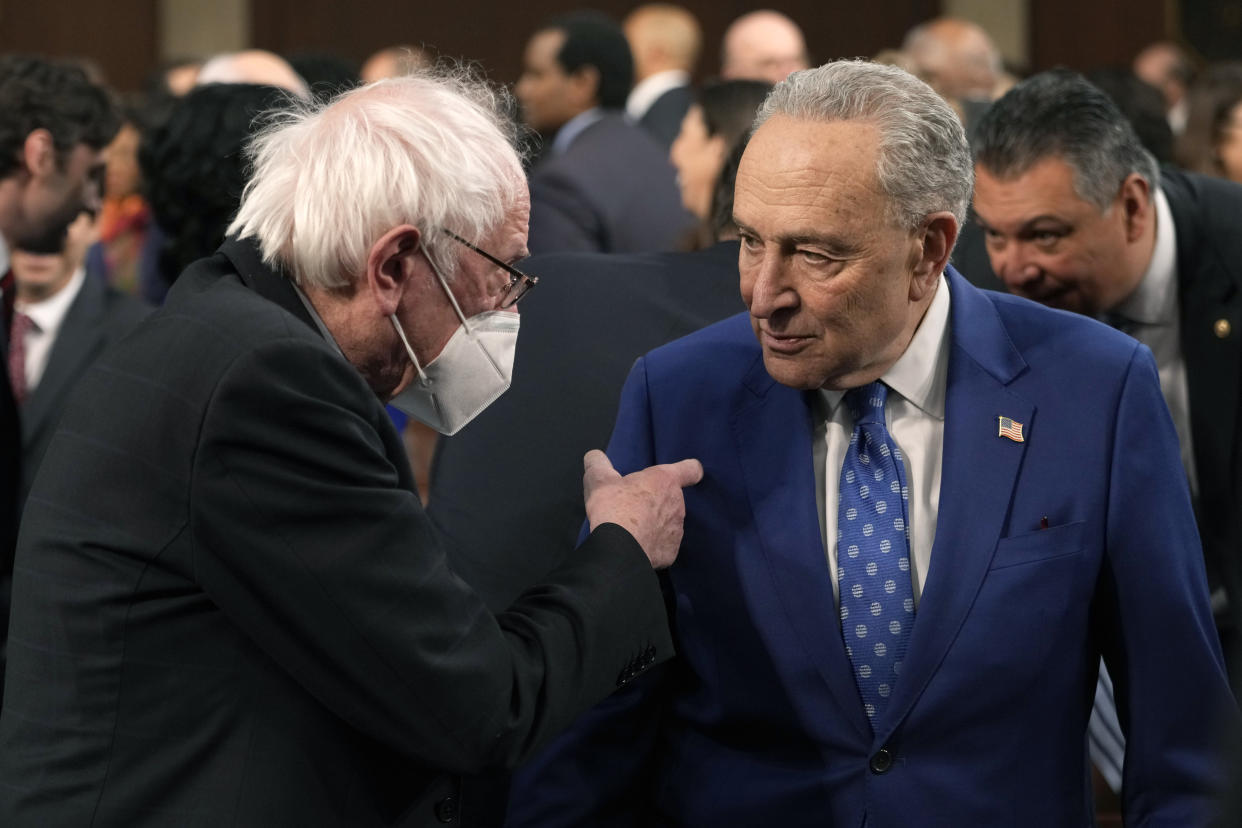 Sen. Bernie Sanders, I-Vt., talks with Senate Majority Leader Chuck Schumer of N.Y., before President Joe Biden delivers the State of the Union address to a joint session of Congress at the Capitol, Tuesday, Feb. 7, 2023, in Washington. (AP Photo/Jacquelyn Martin, Pool)