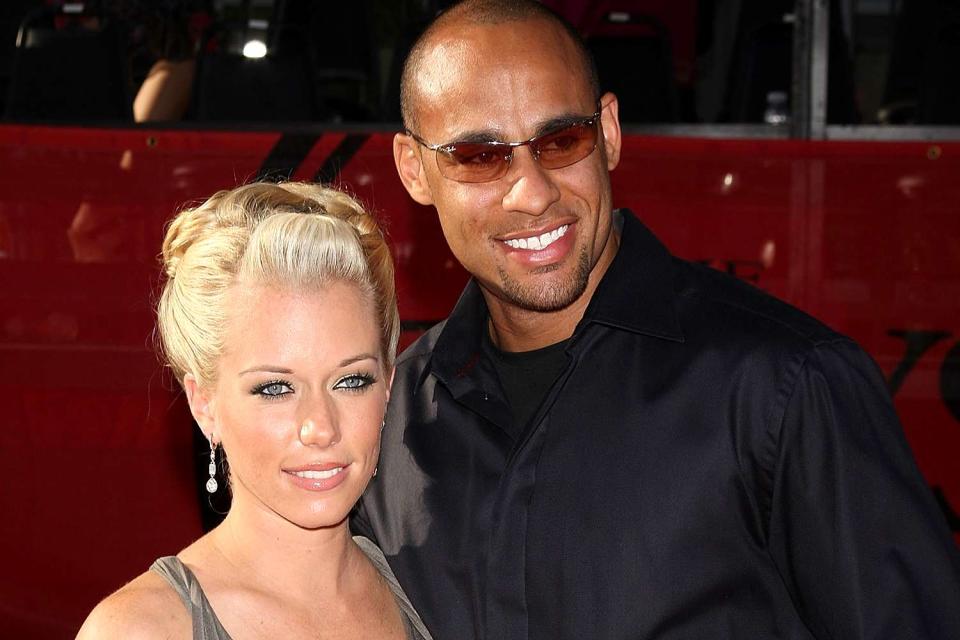 <p>Jason Merritt/Getty</p> Kendra Wilkinson (left) and Hank Baskett in July 2009