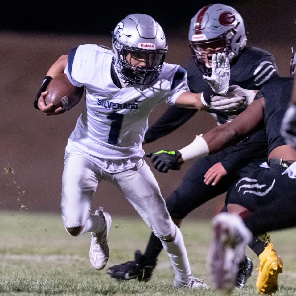 Silverado’s Darren Gandy runs the ball upfield against Granite Hills on Friday, April 2, 2021. The Hawks topped the Cougars 44-24.