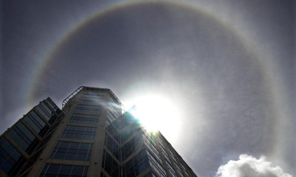 A ring around the sun, is seen over Fort Lauderdale, Fla., Friday, May 17, 2002. The halo is a rare effect on the sun caused by a layer of ice crystals in the atmosphere refracting light from the sun.