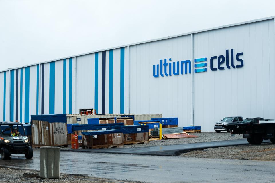 A construction worker drives a vehicle past the Ultium Cells sign at the plant in Spring Hill, Tenn. on Thursday, Aug. 3, 2023.