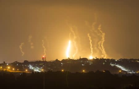 The Israeli community of Netiv Haasara is seen in front of flares fired by the Israeli army in Gaza July 23, 2014. REUTERS/Amir Cohen