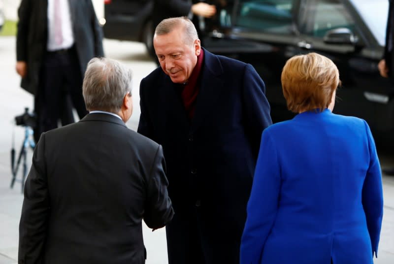 German Chancellor Angela Merkel and United Nations Secretary-General Antonio Guterres welcome Turkish President Recep Tayyip Erdogan at the Libya summit in Berlin