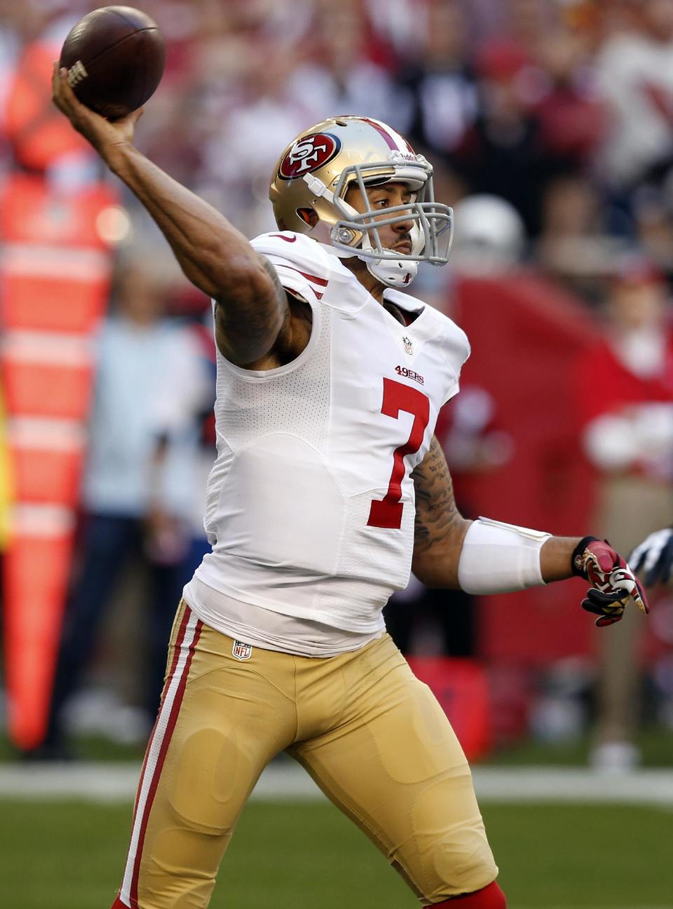 San Francisco 49ers quarterback Colin Kaepernick throws against the Arizona Cardinals during the first half of an NFL football game, Sunday, Dec. 29, 2013, in Glendale, Ariz. (AP Photo/Ross D. Franklin)