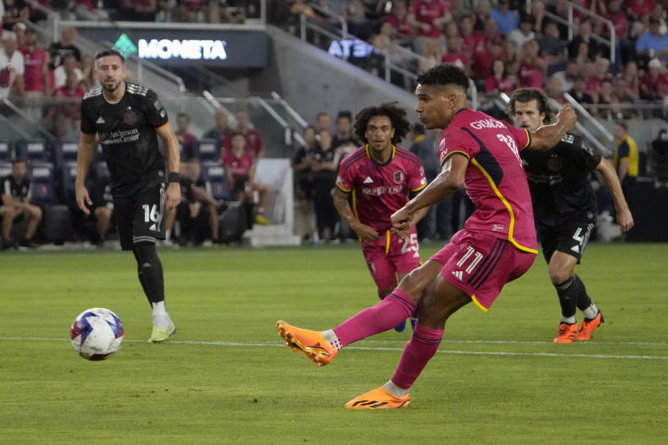 St. Louis City's Nicholas Gioacchini (11) scores on a penalty kick during the second half of an MLS soccer match against the Houston Dynamo Saturday, June 3, 2023, in St. Louis. (AP Photo/Jeff Roberson)