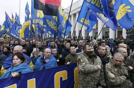 Activists of nationalist groups and their supporters take part in the so-called March of Dignity, marking the third anniversary of the 2014 Ukrainian pro-European Union (EU) mass protests, in Kiev, Ukraine, February 22, 2017. REUTERS/Valentyn Ogirenko