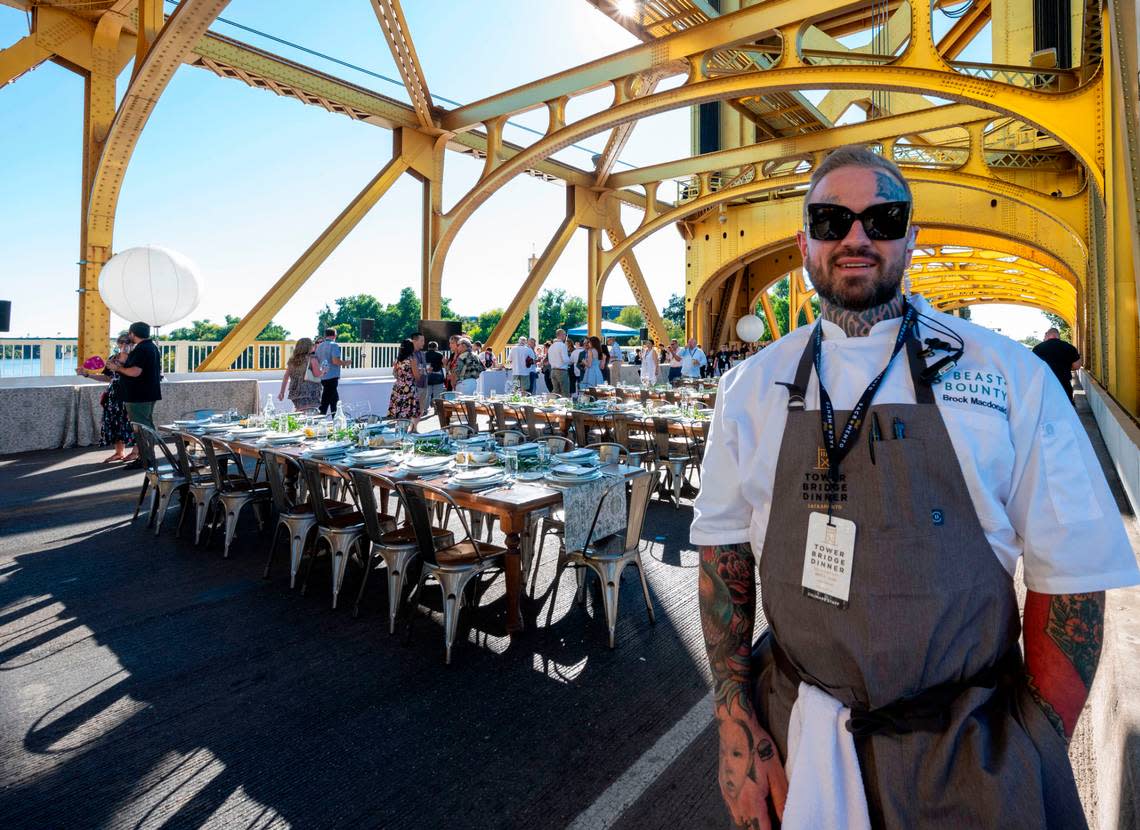 Brock Macdonald of Beast + Bounty, lead chef of the Tower Bridge Dinner, stands waits as guests arrive Sunday.