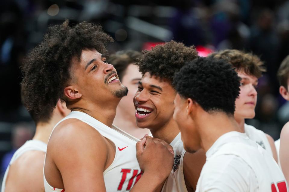The Fishers Tigers celebrate their win against the Ben Davis Giants on Saturday, March 30, 2024, during the IHSAA boys basketball Class 4A state championship game at Gainbridge Fieldhouse in Indianapolis. The Fishers Tigers defeated the Ben Davis Giants 65-56.